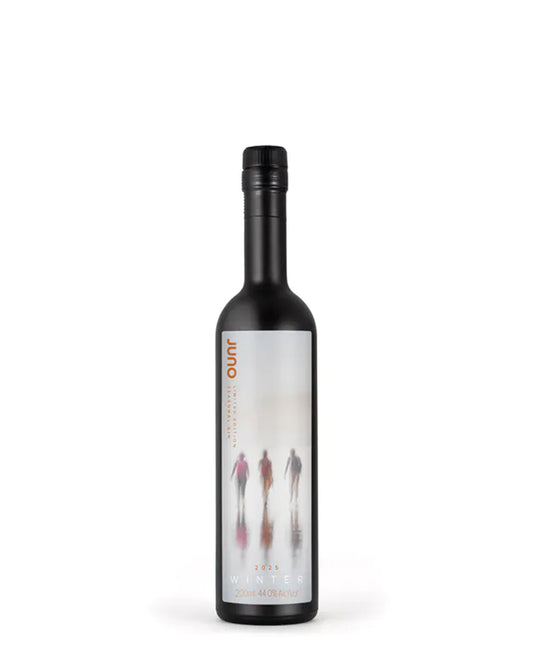 200ml bottle of Juno Spirits Winter 2025 Seasonal Gin, a limited-edition small-batch gin with notes of black olive, olive leaf, and Tahitian lime.